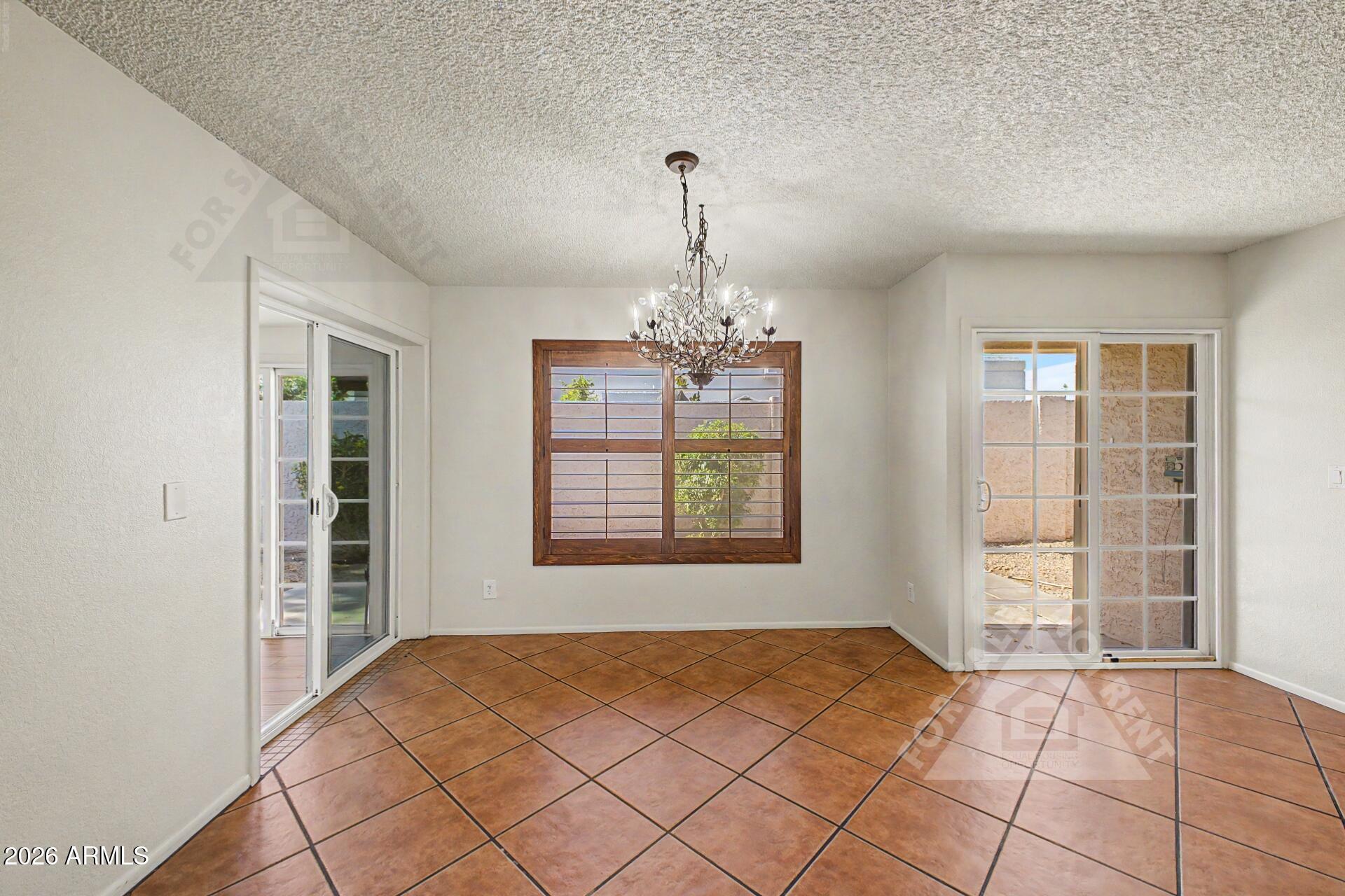 912 East Villa Rita Drive Phoenix, AZ 85022 - Photo 9 of 27 an empty room with windows