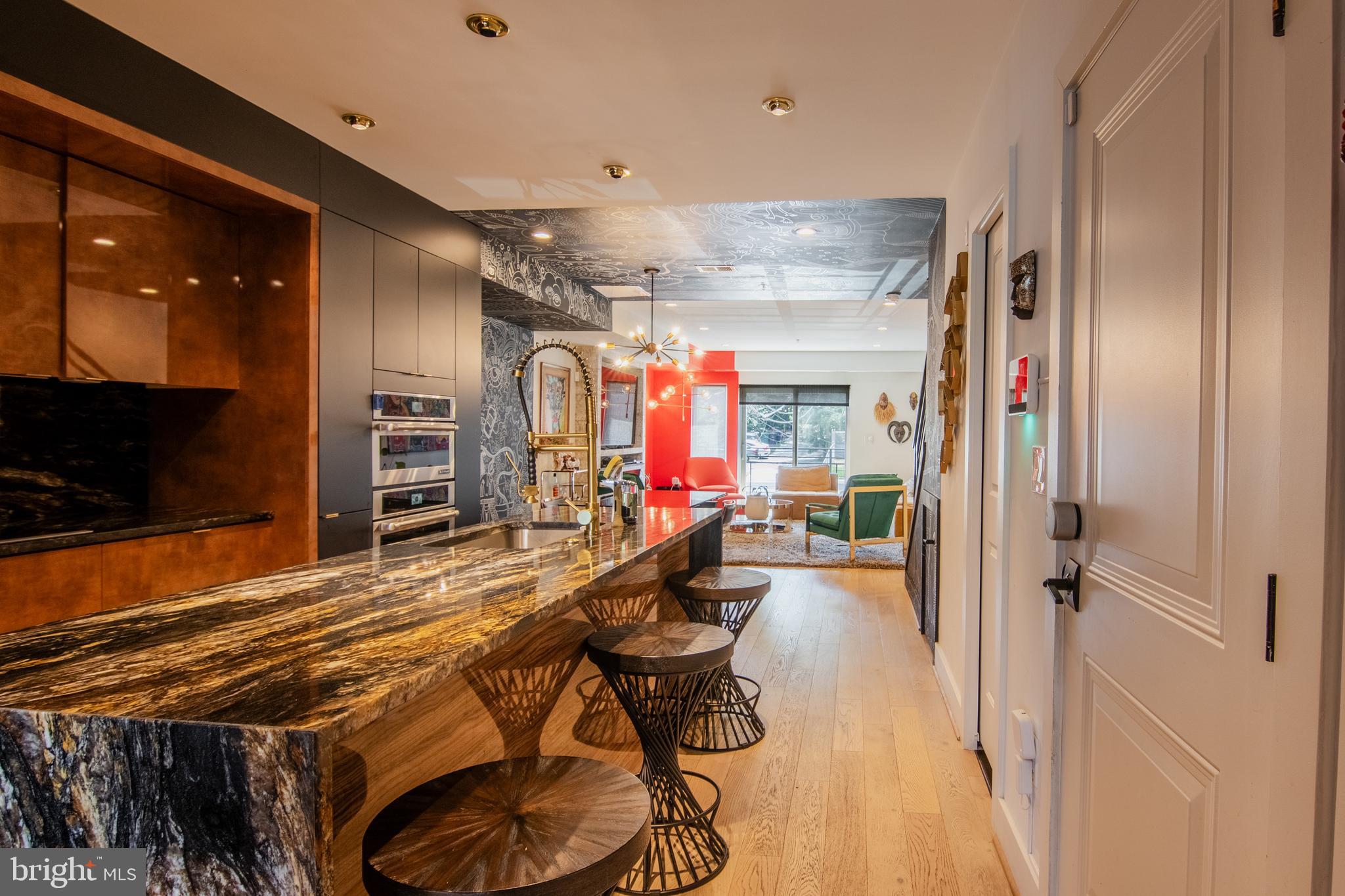 1631 Montello Avenue Northeast, Unit PH1 Washington, DC 20002 - Photo 2 of 51 a view of a room with gym equipment