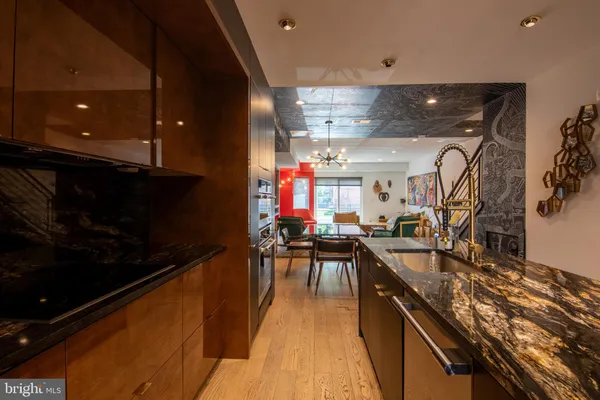 a kitchen with lots of counter top space and stainless steel appliances