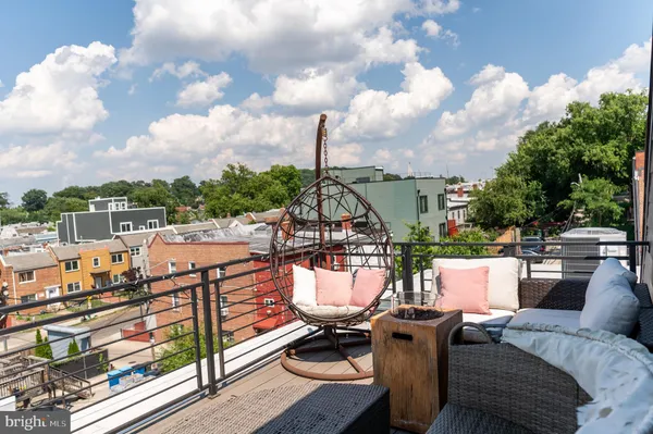 a view of a terrace with furniture