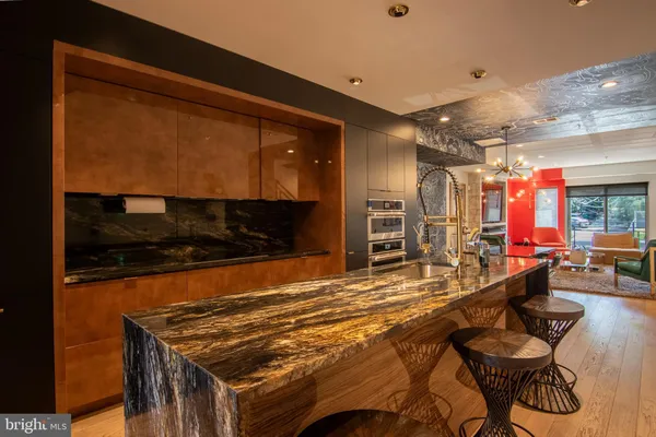 a room with table chairs and a stove