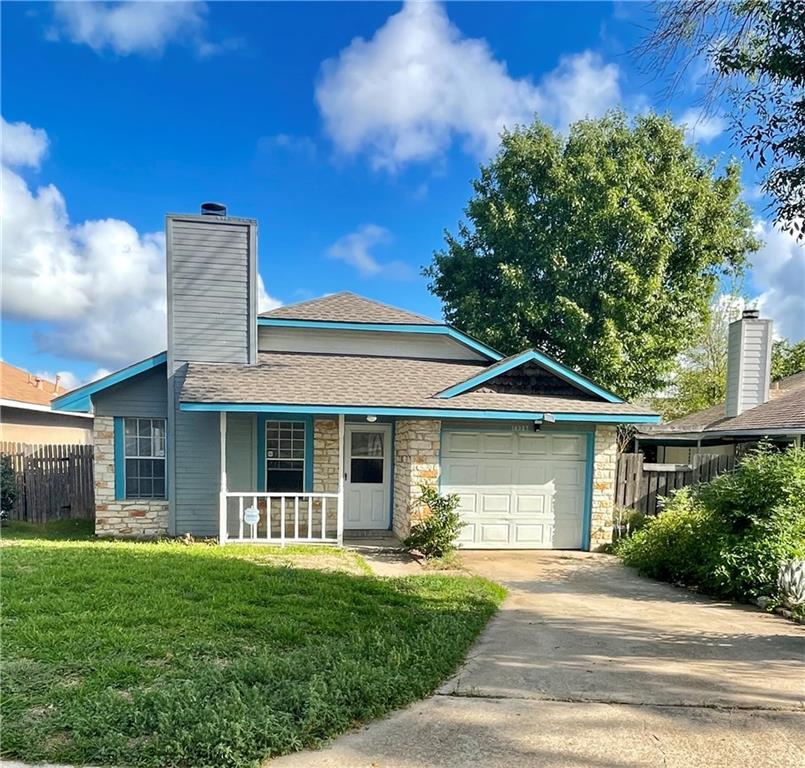 16927 Whitebrush Loop Austin, TX 78717 - Photo 1 of 28 a front view of a house with a garden