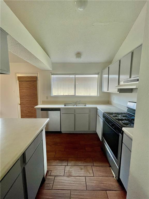 16927 Whitebrush Loop Austin, TX 78717 - Photo 5 of 28 a kitchen with a sink stove and cabinets
