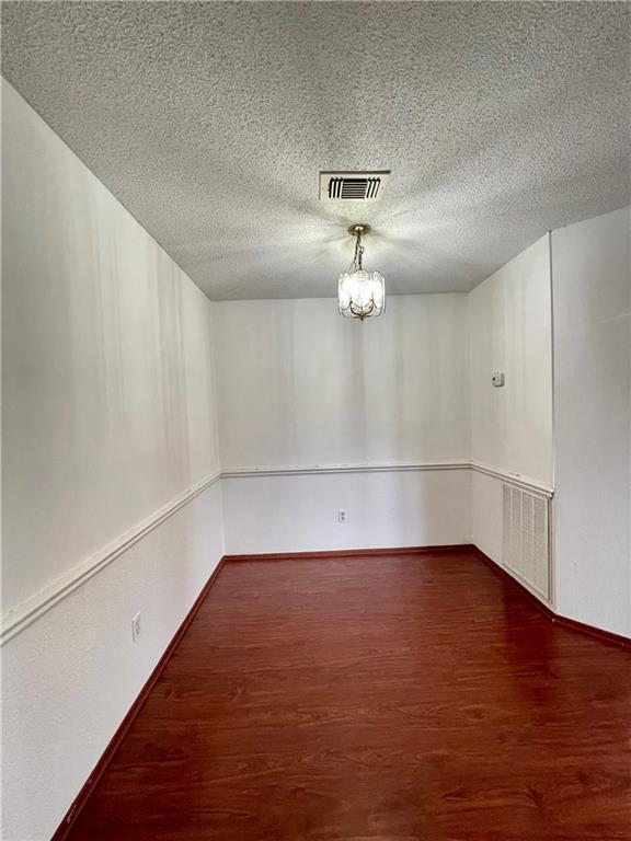 16927 Whitebrush Loop Austin, TX 78717 - Photo 6 of 28 a view of an empty room with wooden floor