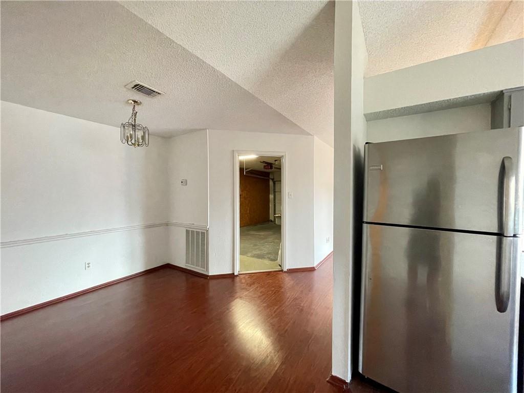 16927 Whitebrush Loop Austin, TX 78717 - Photo 7 of 28 a view of a room with wooden floor and a window