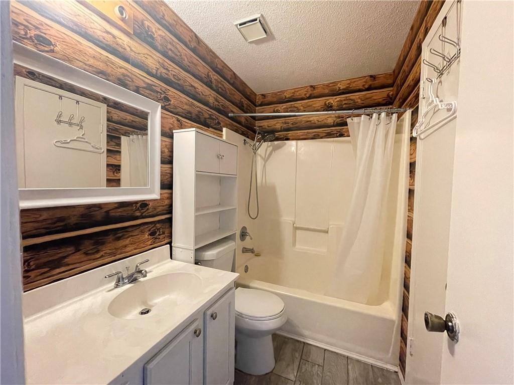 16927 Whitebrush Loop Austin, TX 78717 - Photo 8 of 28 a bathroom with a sink a toilet and shower