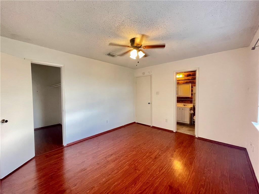 16927 Whitebrush Loop Austin, TX 78717 - Photo 9 of 28 a view of empty room with wooden floor and fan