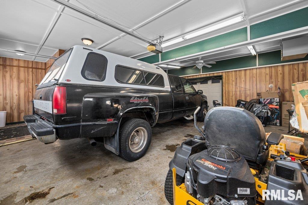 409 233rd Street Aledo, IL 61231 - Photo 25 of 45 a car is parked in a garage
