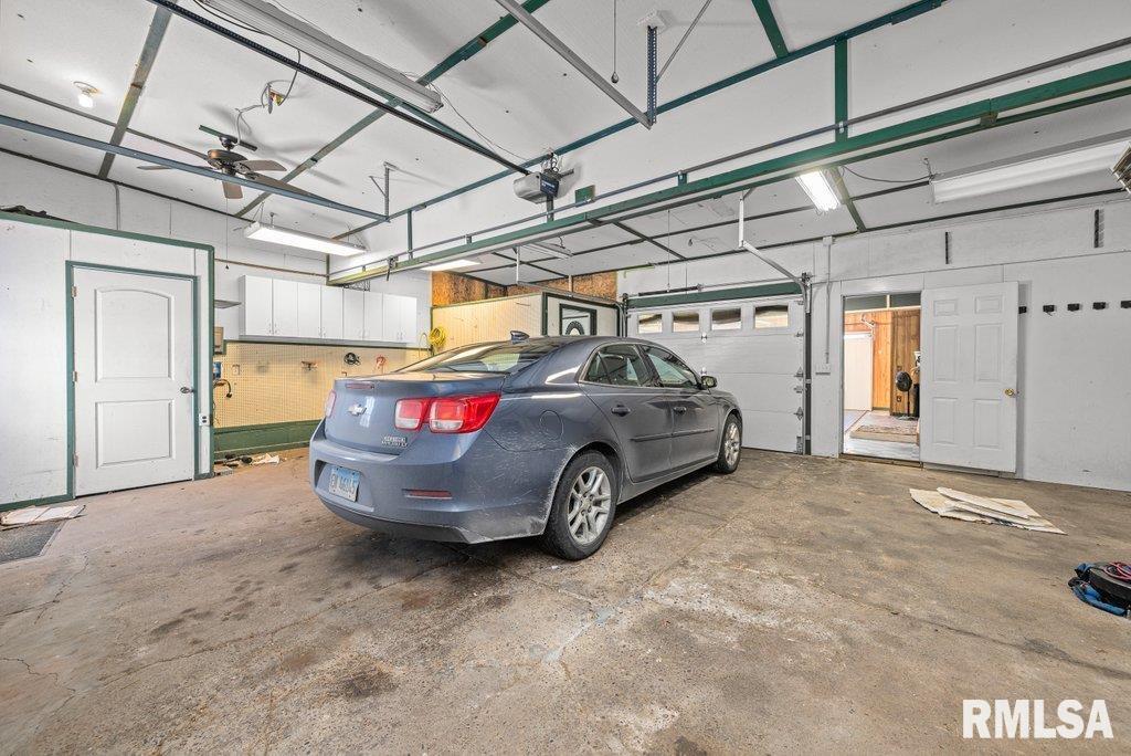 409 233rd Street Aledo, IL 61231 - Photo 28 of 45 a car parked in garage