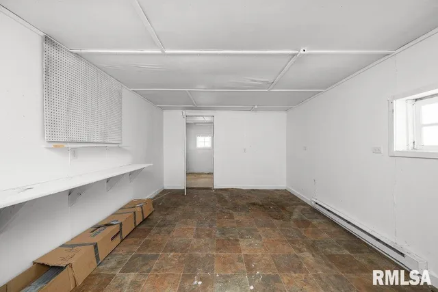 a view of a workspace with furniture