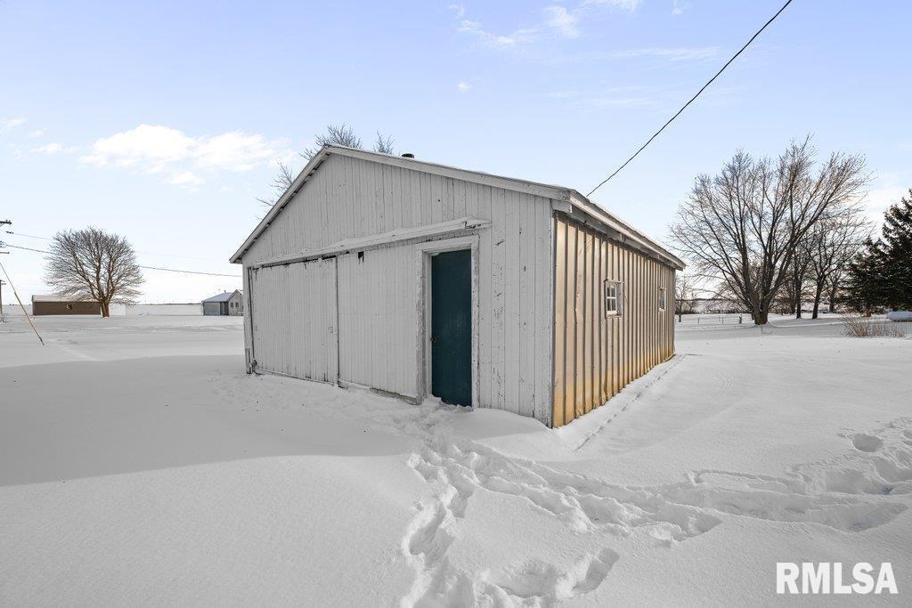 409 233rd Street Aledo, IL 61231 - Photo 35 of 45 a view of a house with a yard and garage