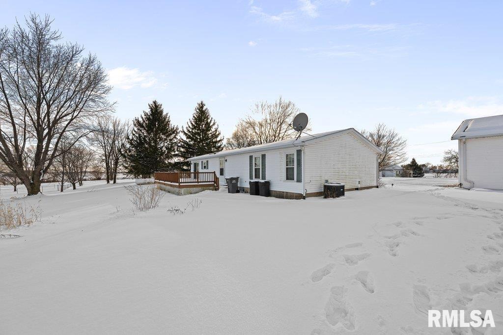 409 233rd Street Aledo, IL 61231 - Photo 37 of 45 a view of house with a yard and covered with snow