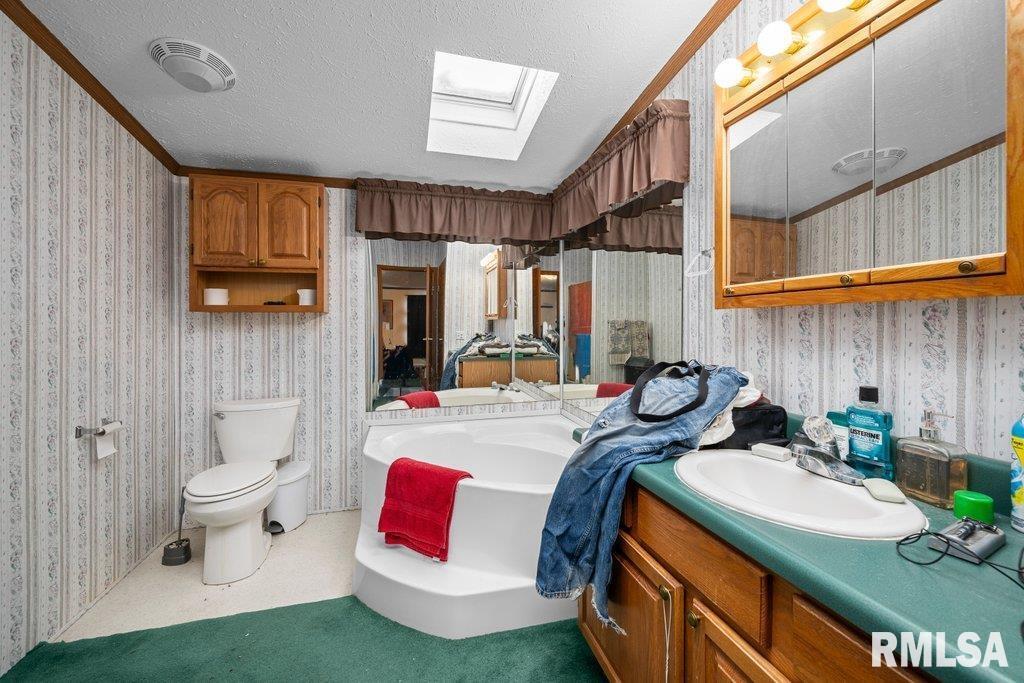 409 233rd Street Aledo, IL 61231 - Photo 7 of 45 a bed room with a bed and a chair