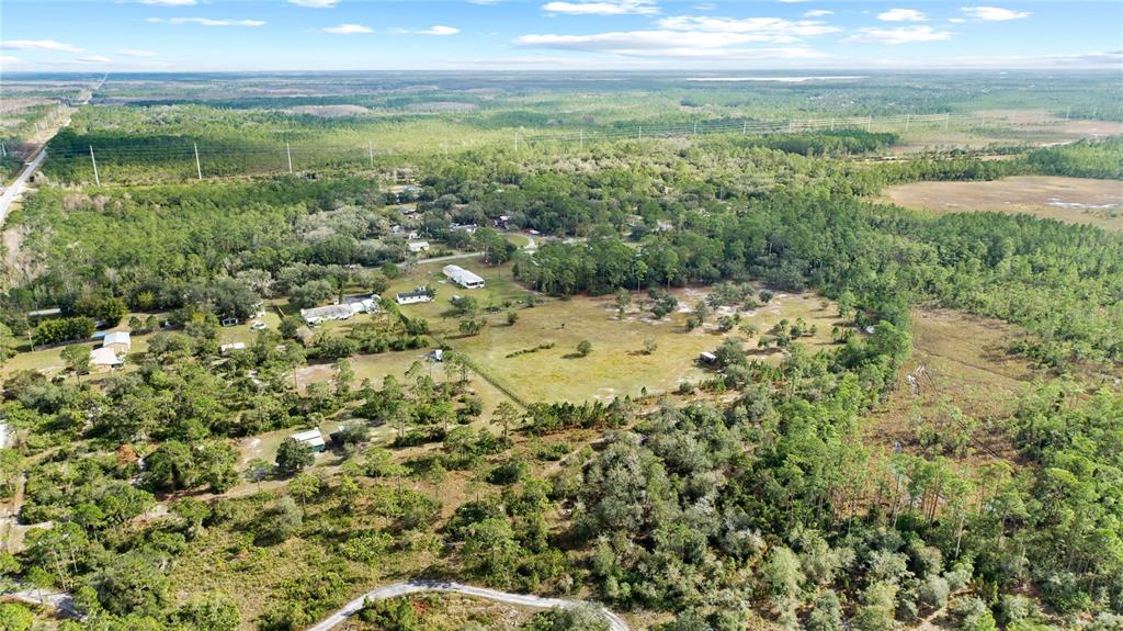 0 7th Street St. Cloud, FL 34771 - Photo 6 of 14 a view of a lake from a yard