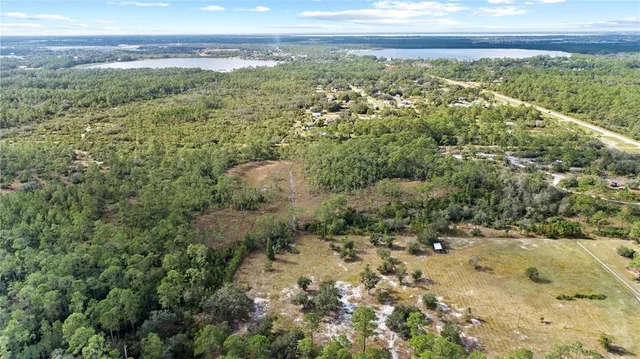 a view of a yard with an ocean view