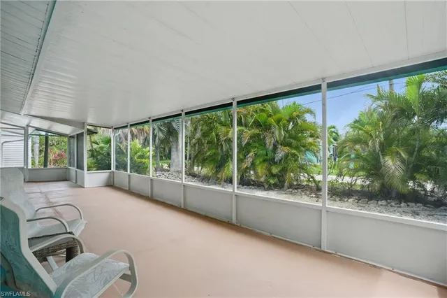 a room with furniture and a large window