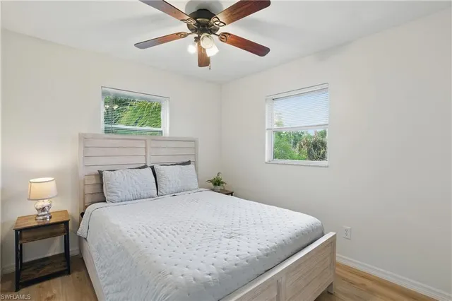 a bedroom with a bed and lamp