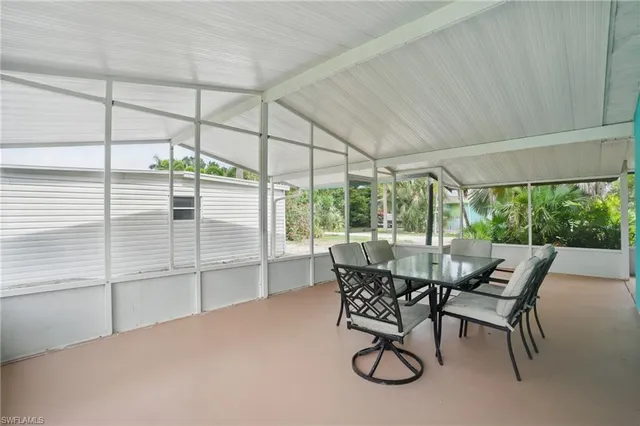 a view of a patio with table and chairs