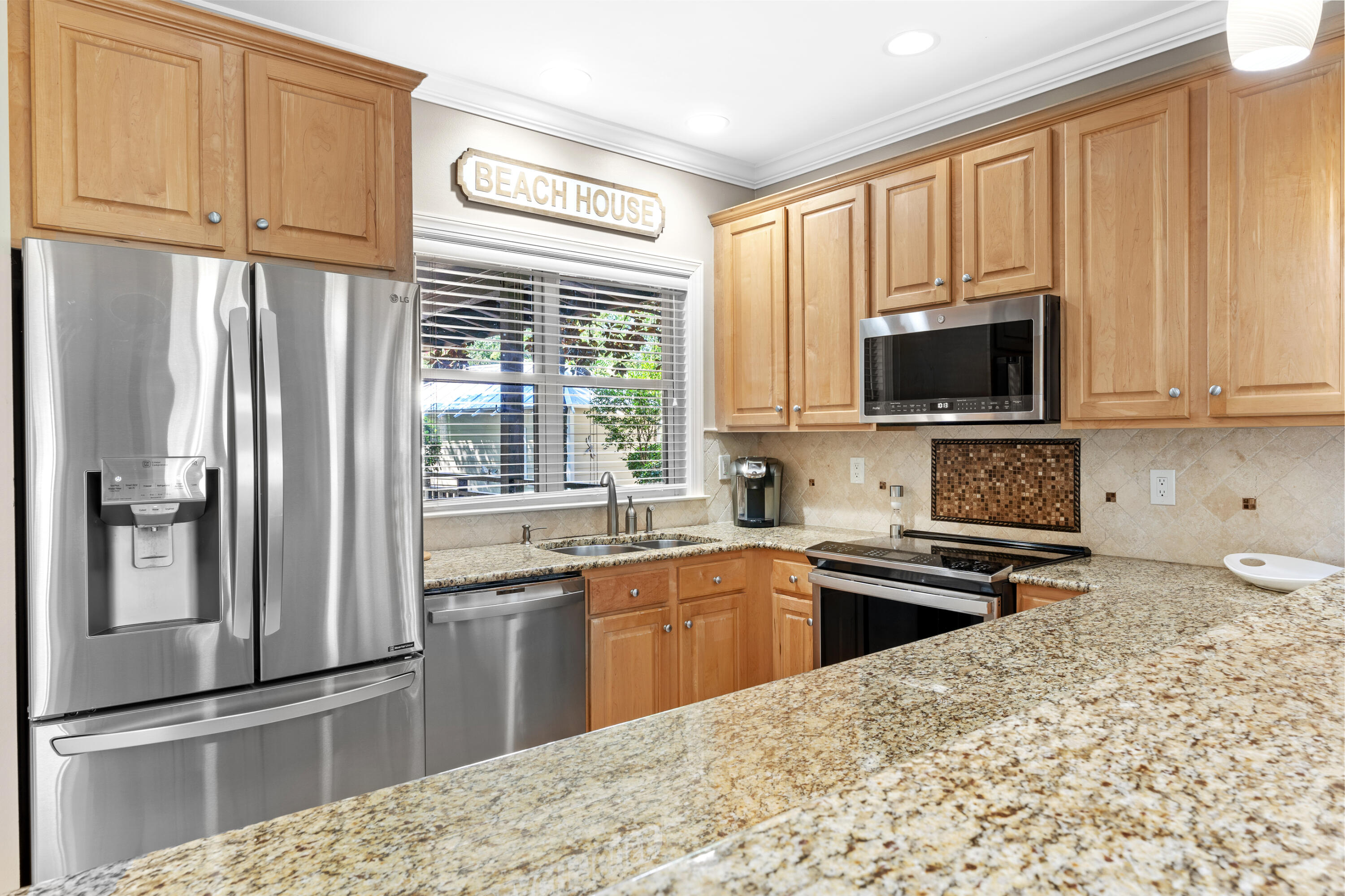 1108 Prestwick Place Miramar Beach, FL 32550 - Photo 11 of 47 a kitchen with stainless steel appliances granite countertop a refrigerator stove top oven and sink