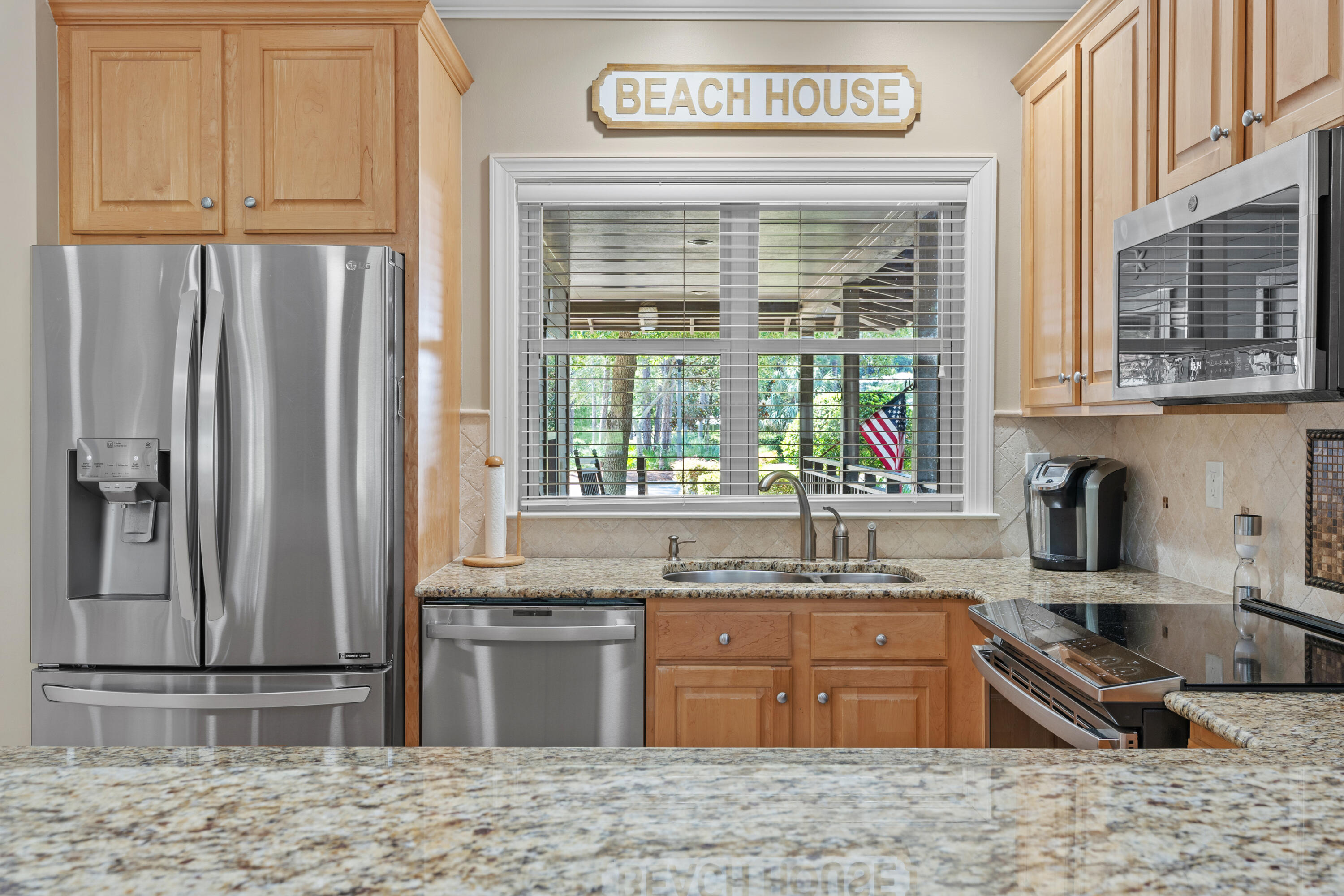 1108 Prestwick Place Miramar Beach, FL 32550 - Photo 13 of 47 a kitchen with stainless steel appliances granite countertop a refrigerator and a sink