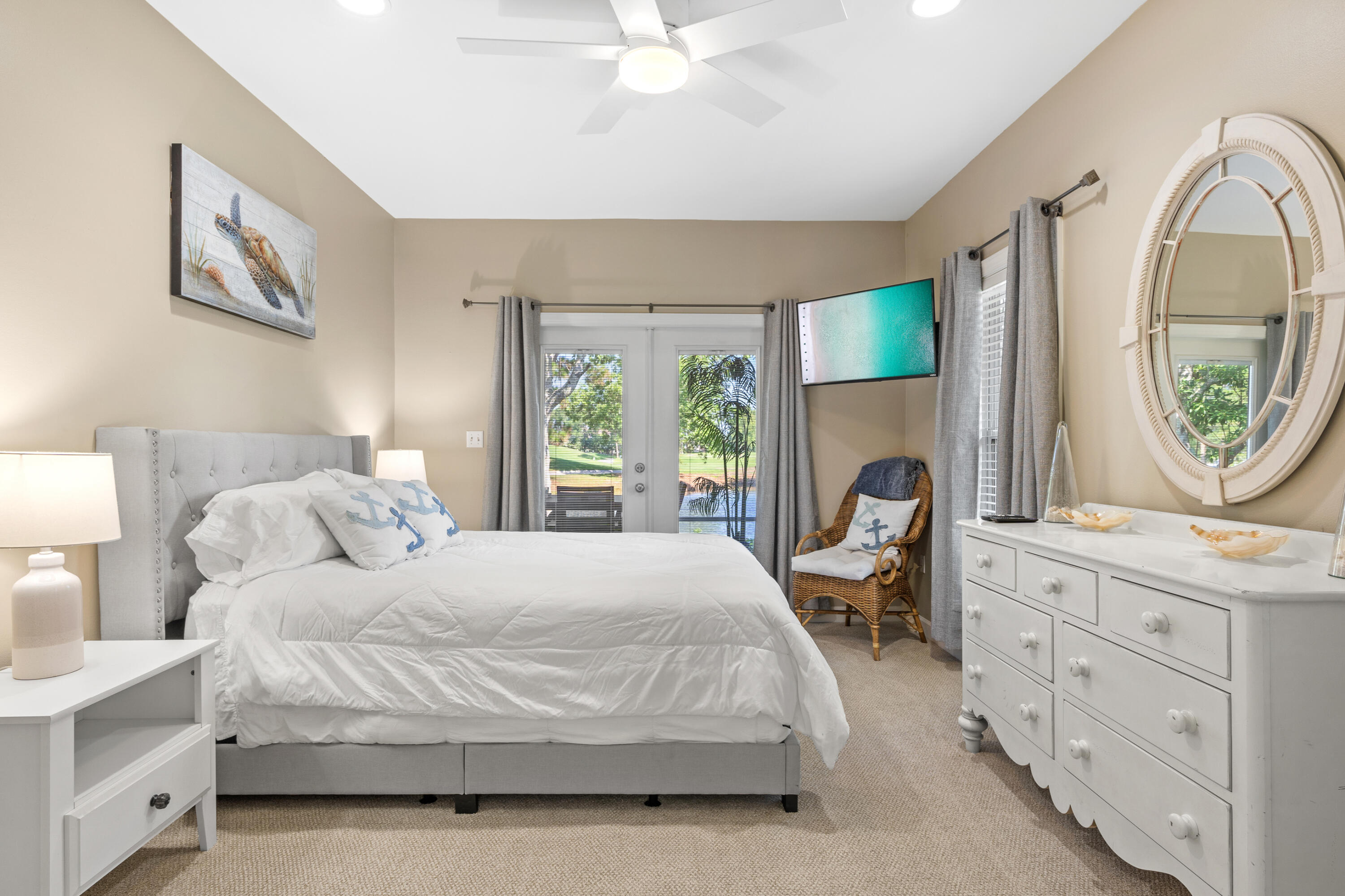 1108 Prestwick Place Miramar Beach, FL 32550 - Photo 17 of 47 a bedroom with a bed a mirror on dresser and a window