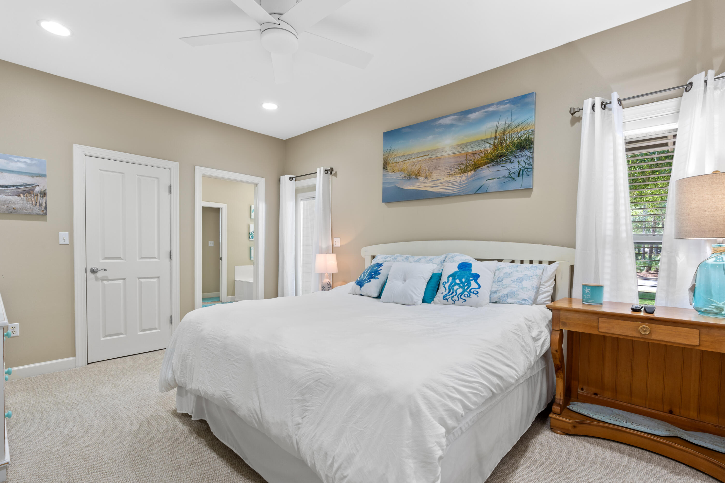 1108 Prestwick Place Miramar Beach, FL 32550 - Photo 22 of 47 a bedroom with a large bed and a chandelier