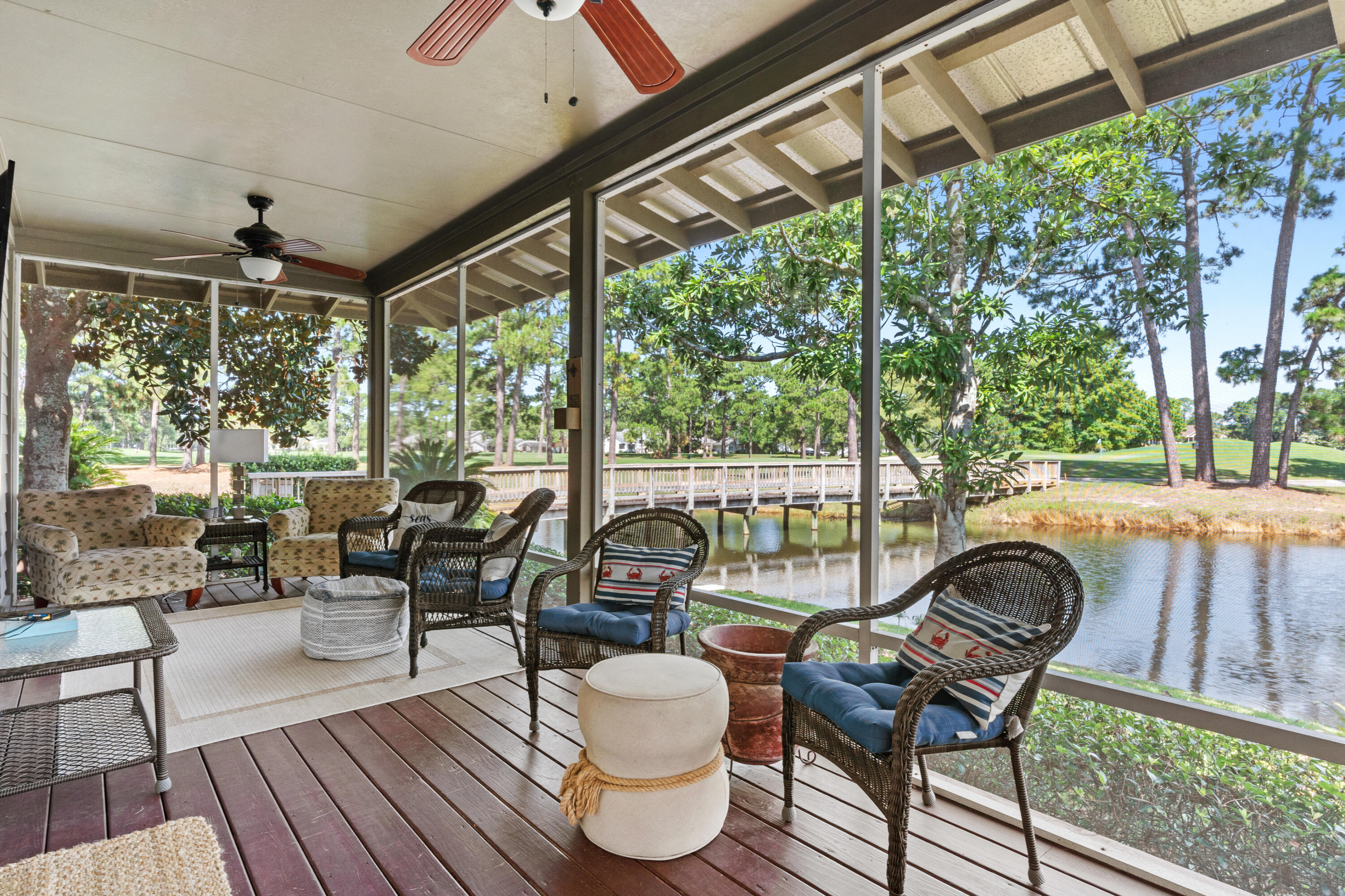 1108 Prestwick Place Miramar Beach, FL 32550 - Photo 31 of 47 a living room with furniture and a floor to ceiling window