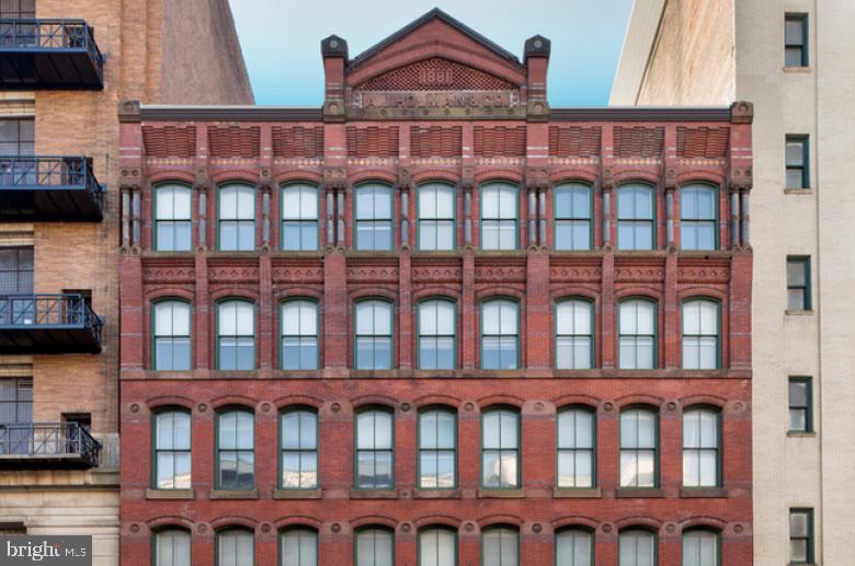 1222-26 Arch Street, Unit 507 Philadelphia, PA 19107 - Photo 22 of 22 a front view of a residential apartment building with a door