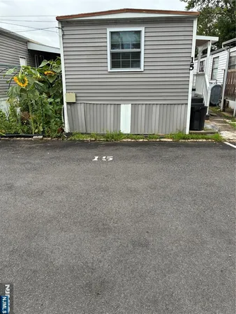 a view of a house with a street