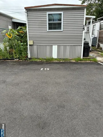 a view of a house with a street