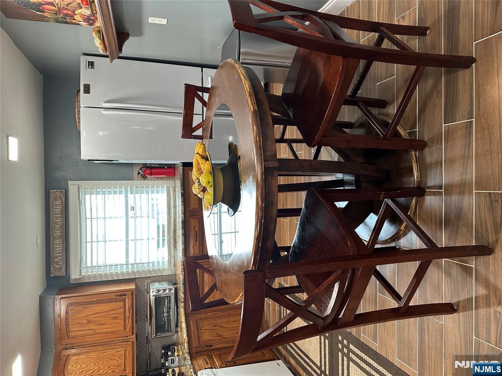 15 2nd Street Lodi, NJ 07644 - Photo 12 of 32 a view of a dining room with furniture and window