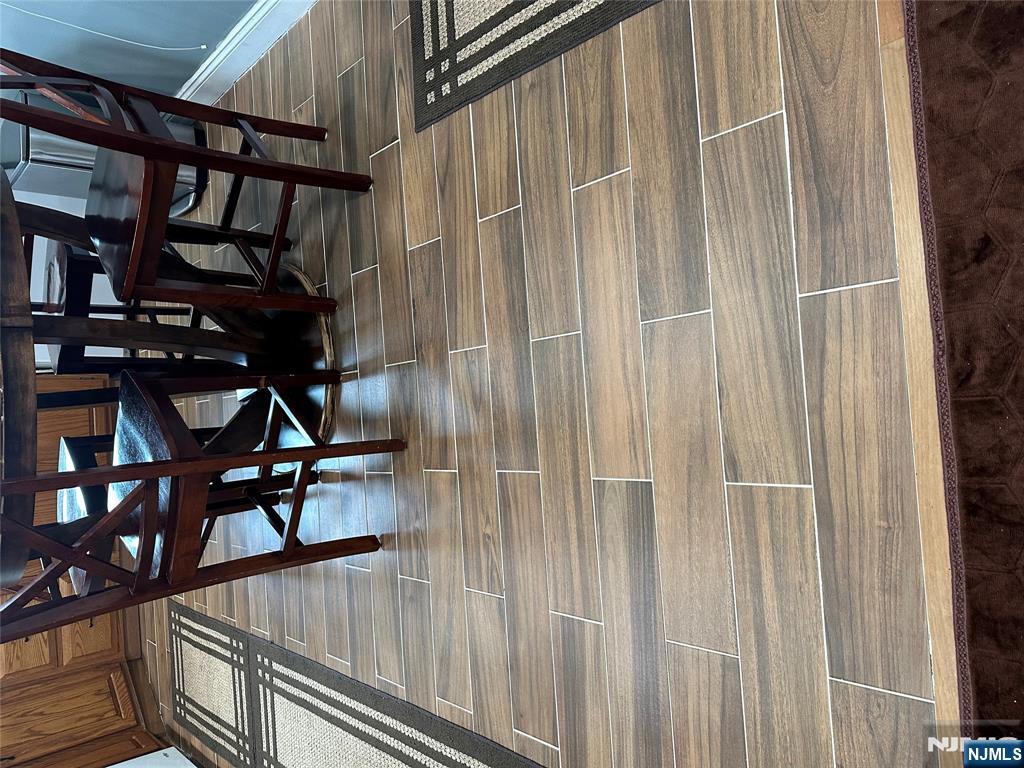 15 2nd Street Lodi, NJ 07644 - Photo 13 of 32 a white bench sitting on top of a wooden floor