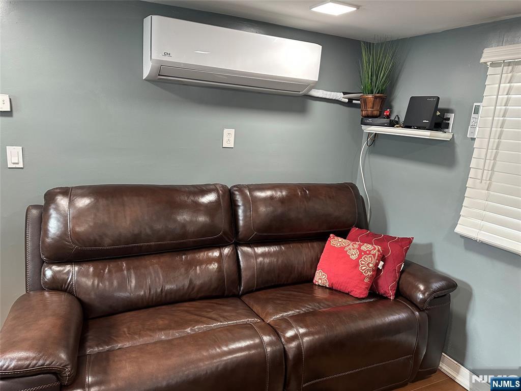 15 2nd Street Lodi, NJ 07644 - Photo 16 of 32 a living room with furniture and a couch