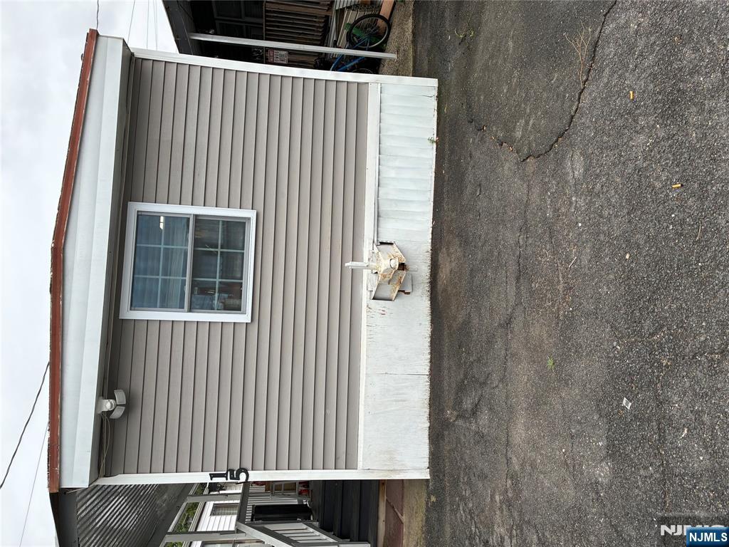15 2nd Street Lodi, NJ 07644 - Photo 2 of 32 a view of a house with a outdoor space