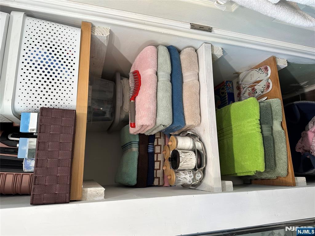 15 2nd Street Lodi, NJ 07644 - Photo 23 of 32 a bathroom with a sink and a mirror