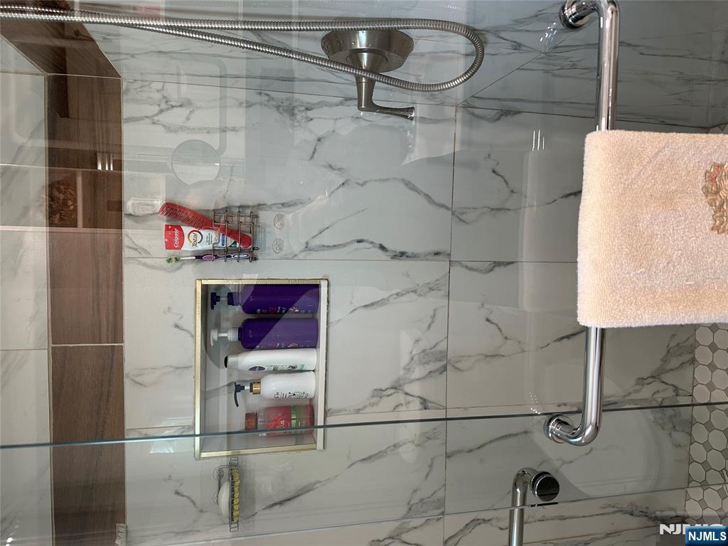 15 2nd Street Lodi, NJ 07644 - Photo 24 of 32 a bathroom with a shower