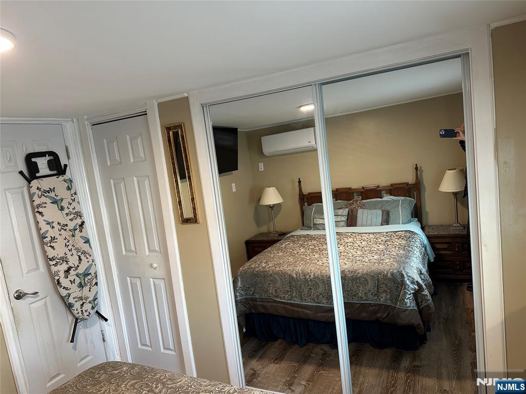 15 2nd Street Lodi, NJ 07644 - Photo 27 of 32 a bedroom with a bed and a window