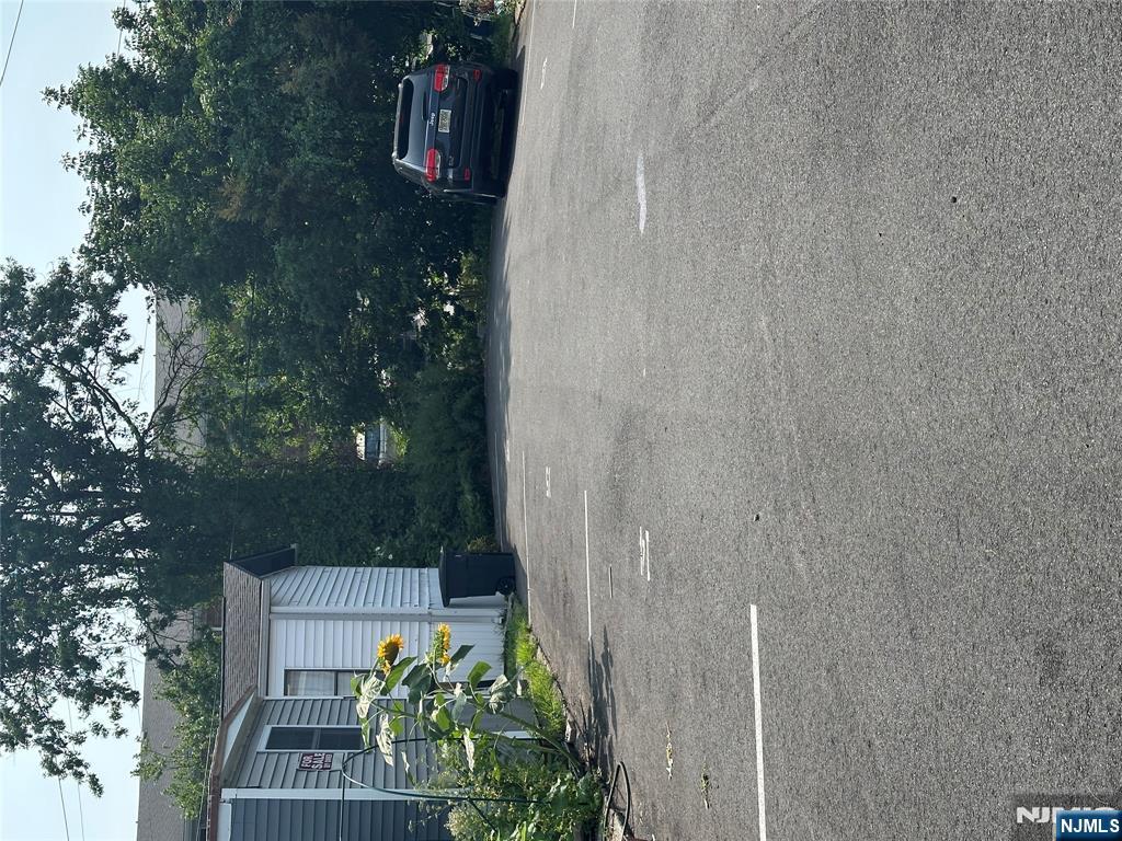 15 2nd Street Lodi, NJ 07644 - Photo 29 of 32 a car parked in front of a house