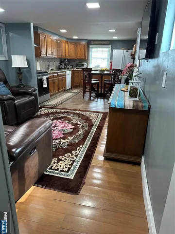 a living room with furniture and a rug