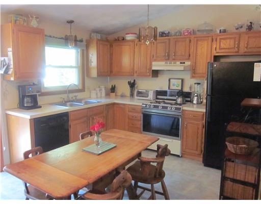 53 Montauk Road Narragansett, RI 02882 - Photo 3 of 11 Kitchen. Bright and sunny eat in kitchen with sliders to deck overlooking backyard.