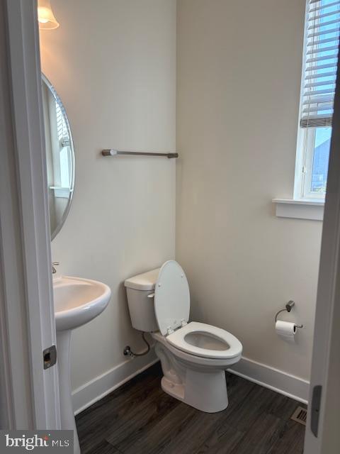 1 Taube Court Owings Mills, MD 21117 - Photo 18 of 36 a white toilet sitting next to a bathroom sink