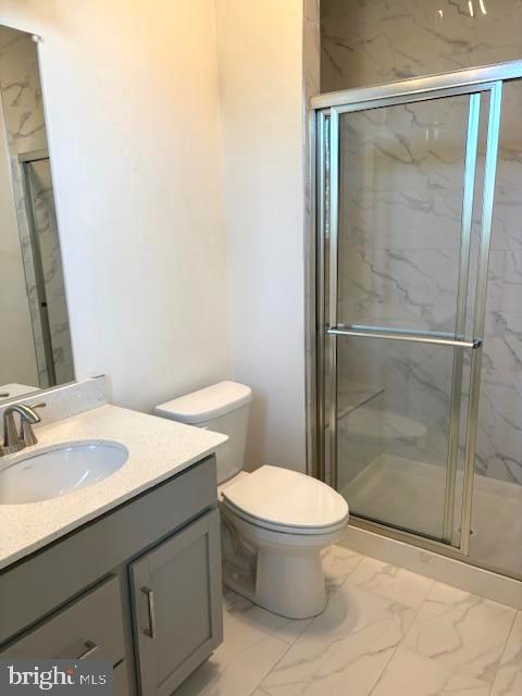 1 Taube Court Owings Mills, MD 21117 - Photo 23 of 36 a bathroom with a sink toilet and shower