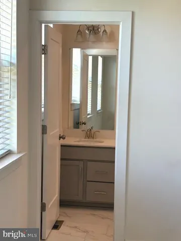 a empty walk in closet room with wooden floor