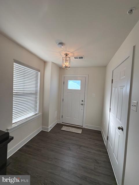 1 Taube Court Owings Mills, MD 21117 - Photo 32 of 36 a view of an empty room with wooden floor and a window