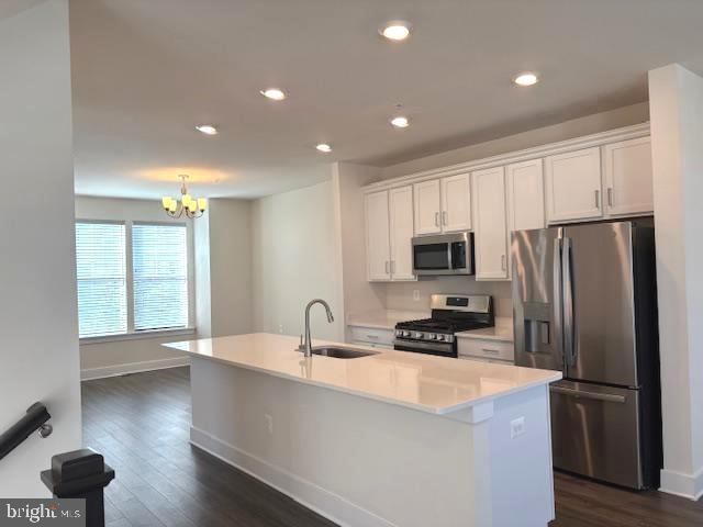 1 Taube Court Owings Mills, MD 21117 - Photo 8 of 36 a kitchen with stainless steel appliances a refrigerator sink and microwave