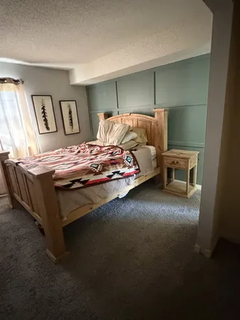 a bedroom with furniture and window