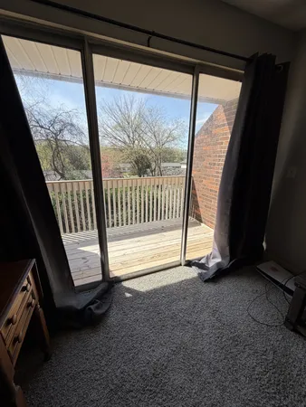 a view of an empty room with a balcony