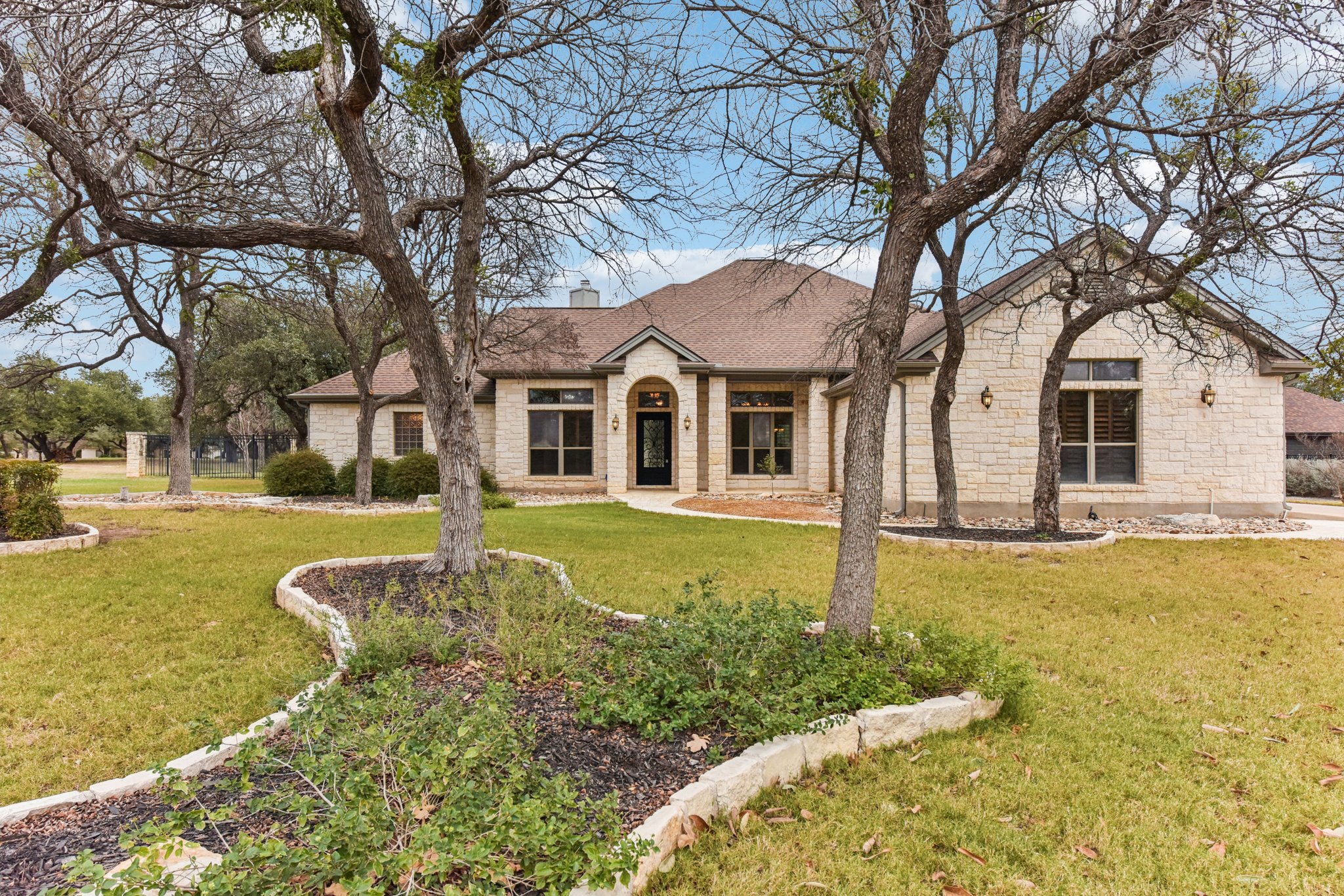105 Silver Leaf Drive Georgetown, TX 78633 - Photo 1 of 40 a front view of a house with a yard table and chairs