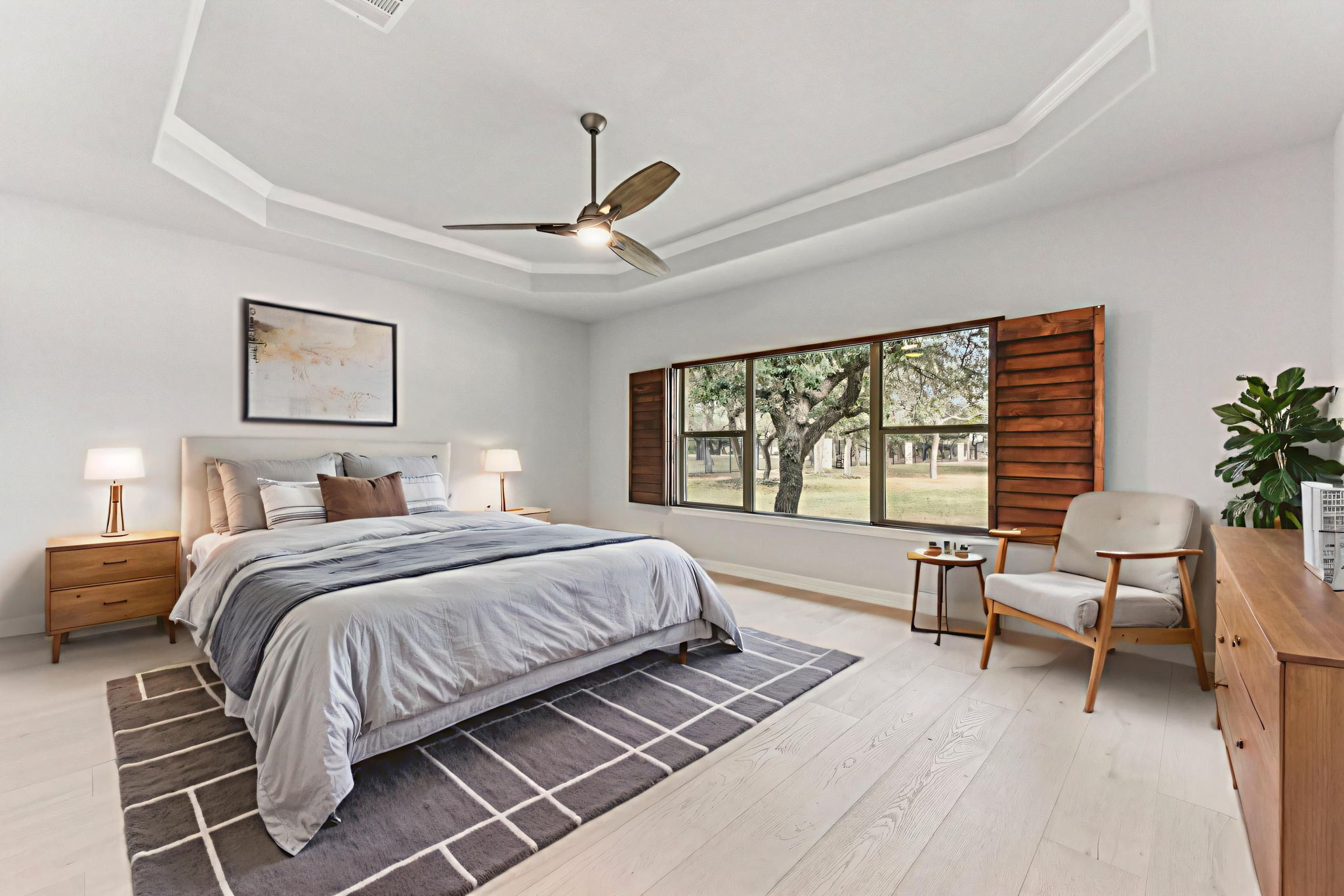 105 Silver Leaf Drive Georgetown, TX 78633 - Photo 12 of 40 a spacious bedroom with a bed a couch and a large window