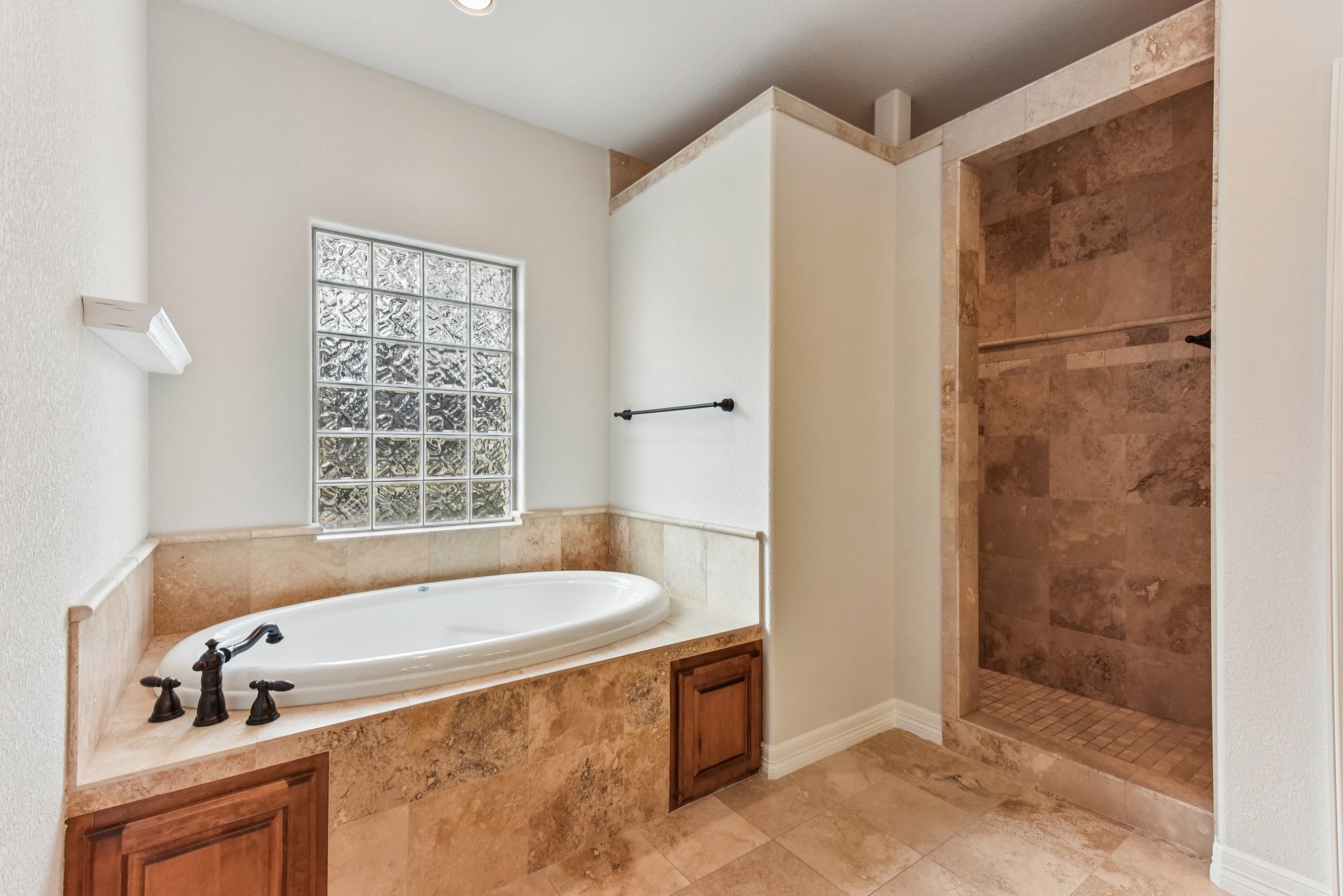 105 Silver Leaf Drive Georgetown, TX 78633 - Photo 14 of 40 a bathroom with a tub and a shower